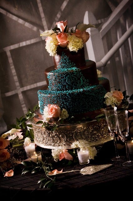 black and turquoise wedding cake tables