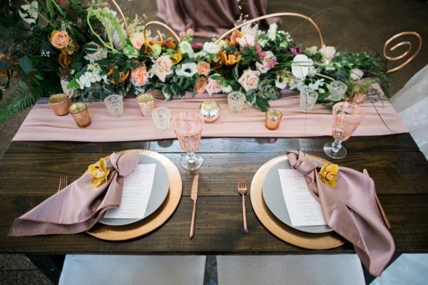 It's ok to splurge on some style upgrades like satin napkins, copper chargers and custom menu cards when it is only a table for 2.