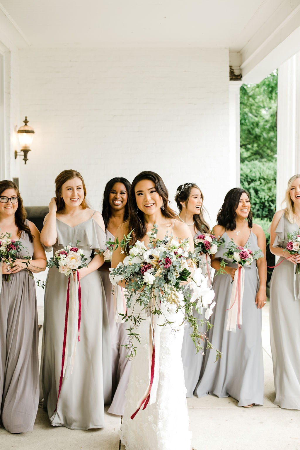 CJ's Off the Square | Bride and bridesmaids in white and grey gowns