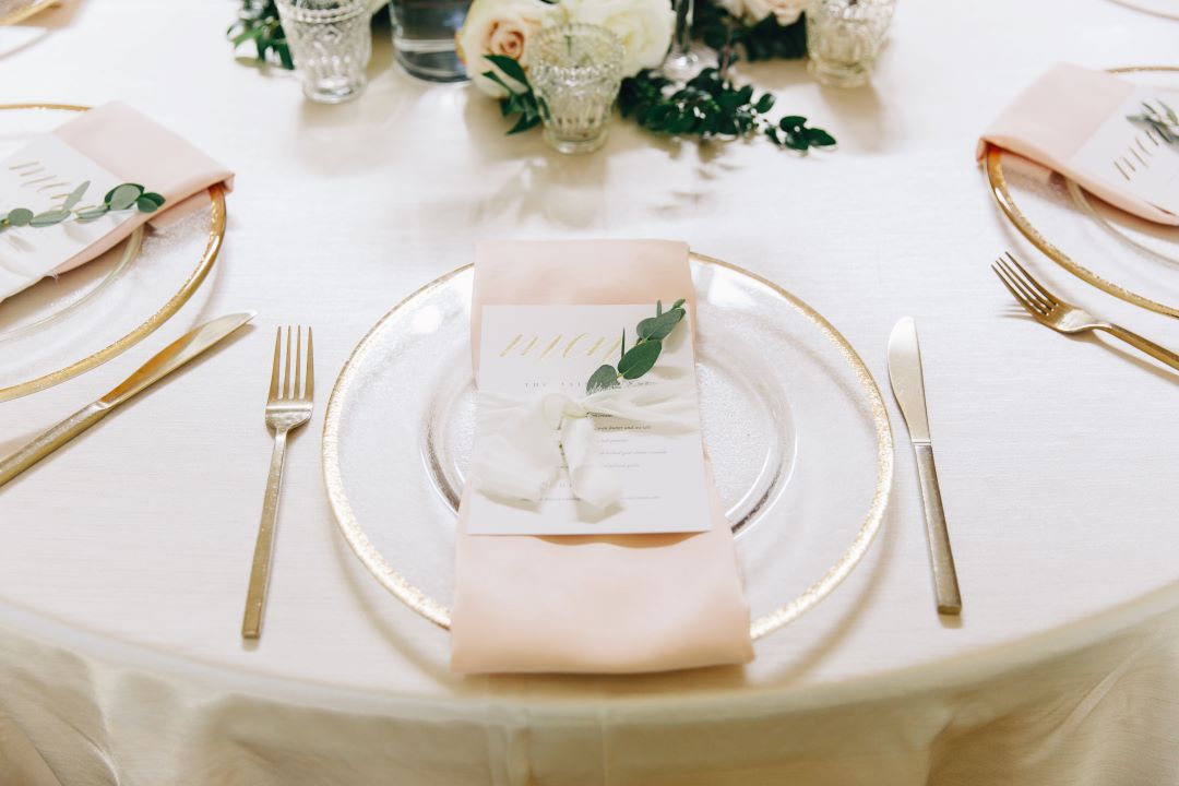 Place settings with blush linens for earthy summer garden wedding in September, neutrals & greenery