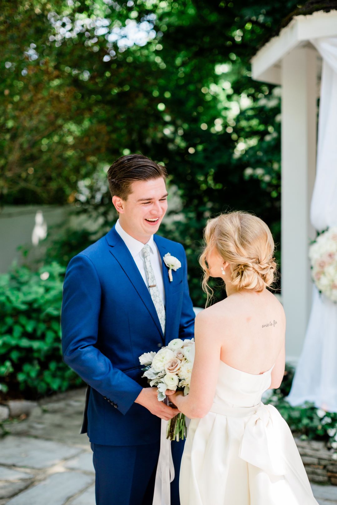 CJ's Off The Square | Bride and groom smiling at each other during their first look