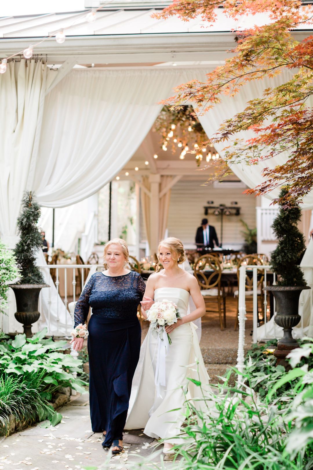 CJ's Off The Square | Bride's mother walking her down the aisle in the garden