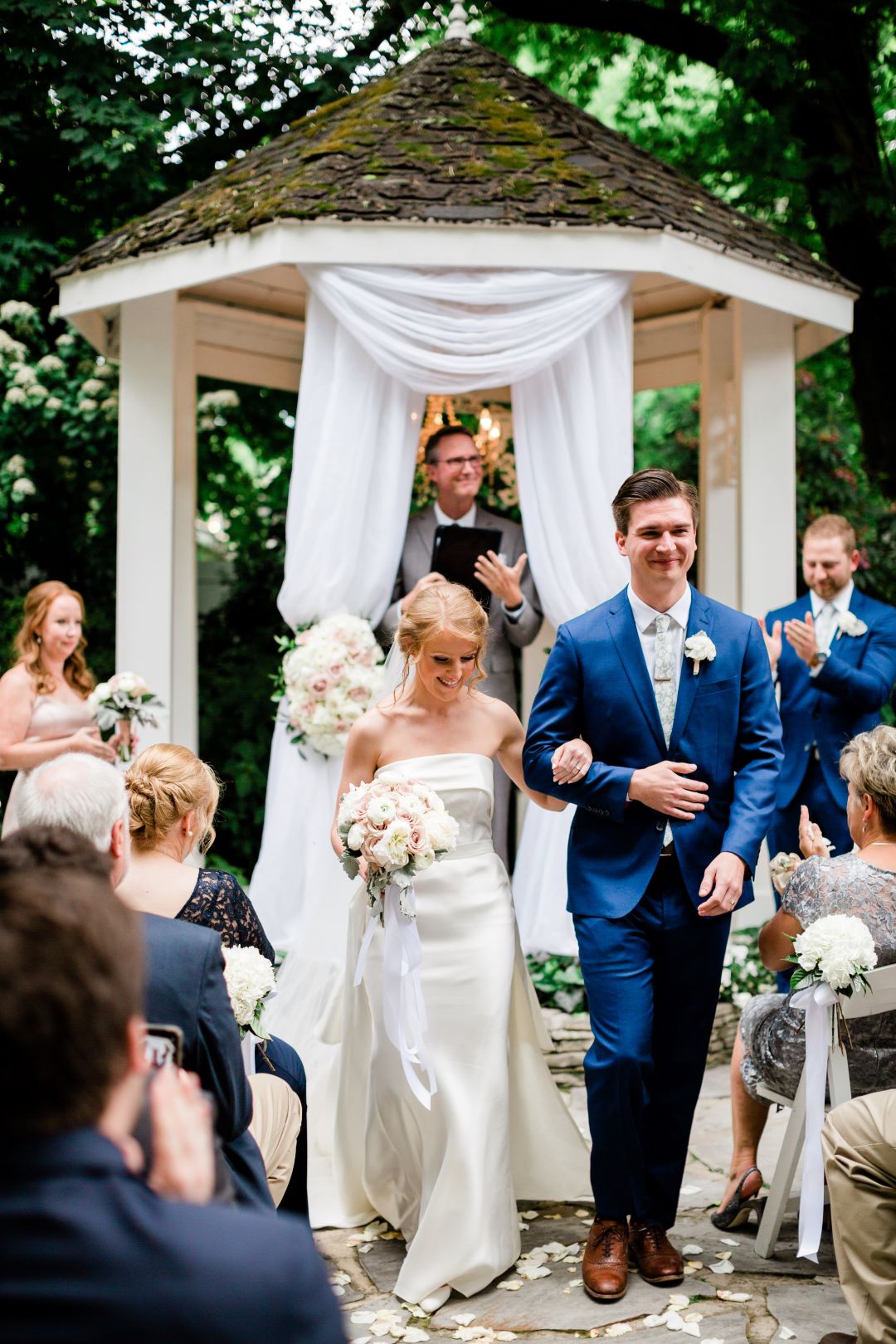 CJ's Off The Square | Bride and groom walking up the aisle as newlyweds