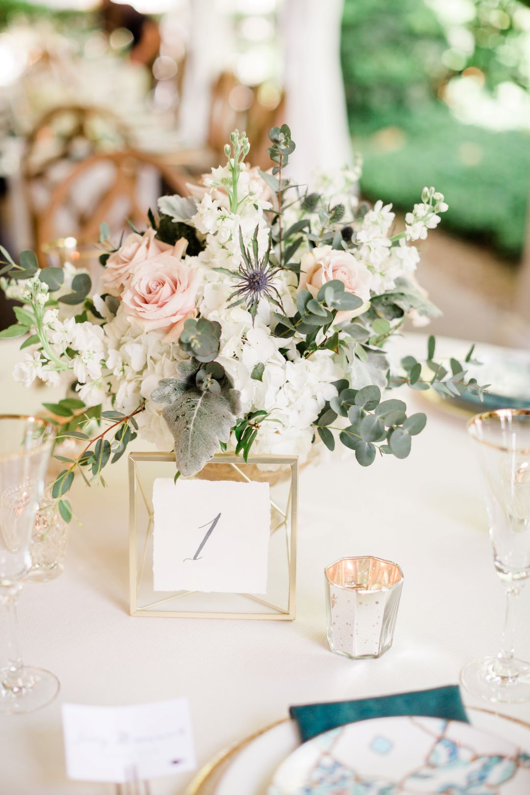 CJ's Off The Square | Blush and white floral centerpieces with tealight candles and gold accents