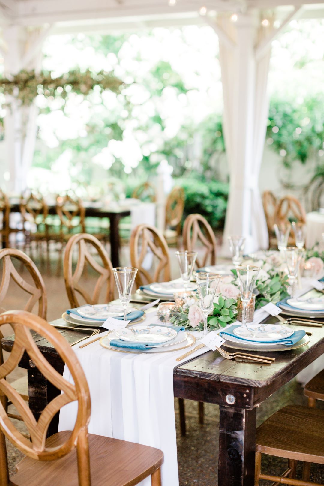 CJ's Off The Square | Unique wooden chairs and blue accents for table settings
