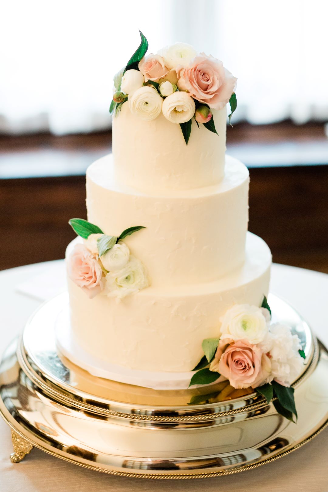 CJ's Off The Square | Simple, elegant wedding cake with blush rose accents