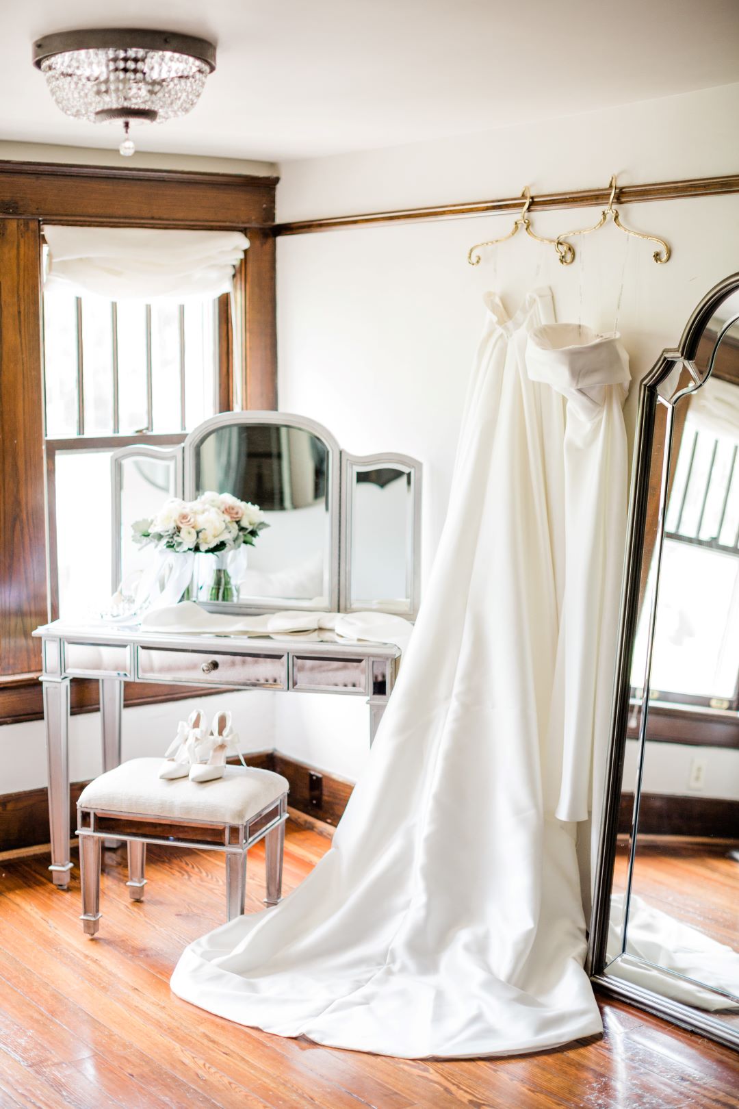 CJ's Off The Square | Wedding gown hanging in bridal dressing room