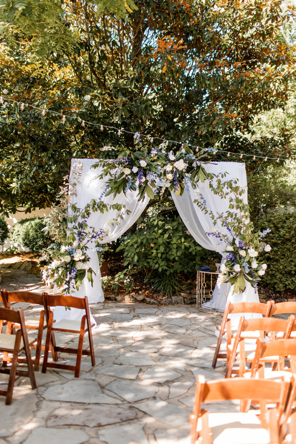 chuppah with white drapes | CJ's Off the Square
