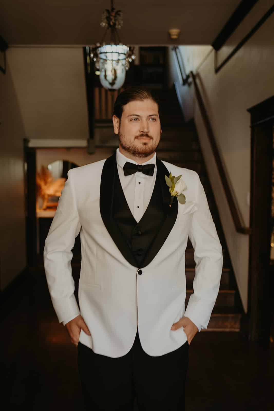 CJ's Off the Square | groom in white tux
