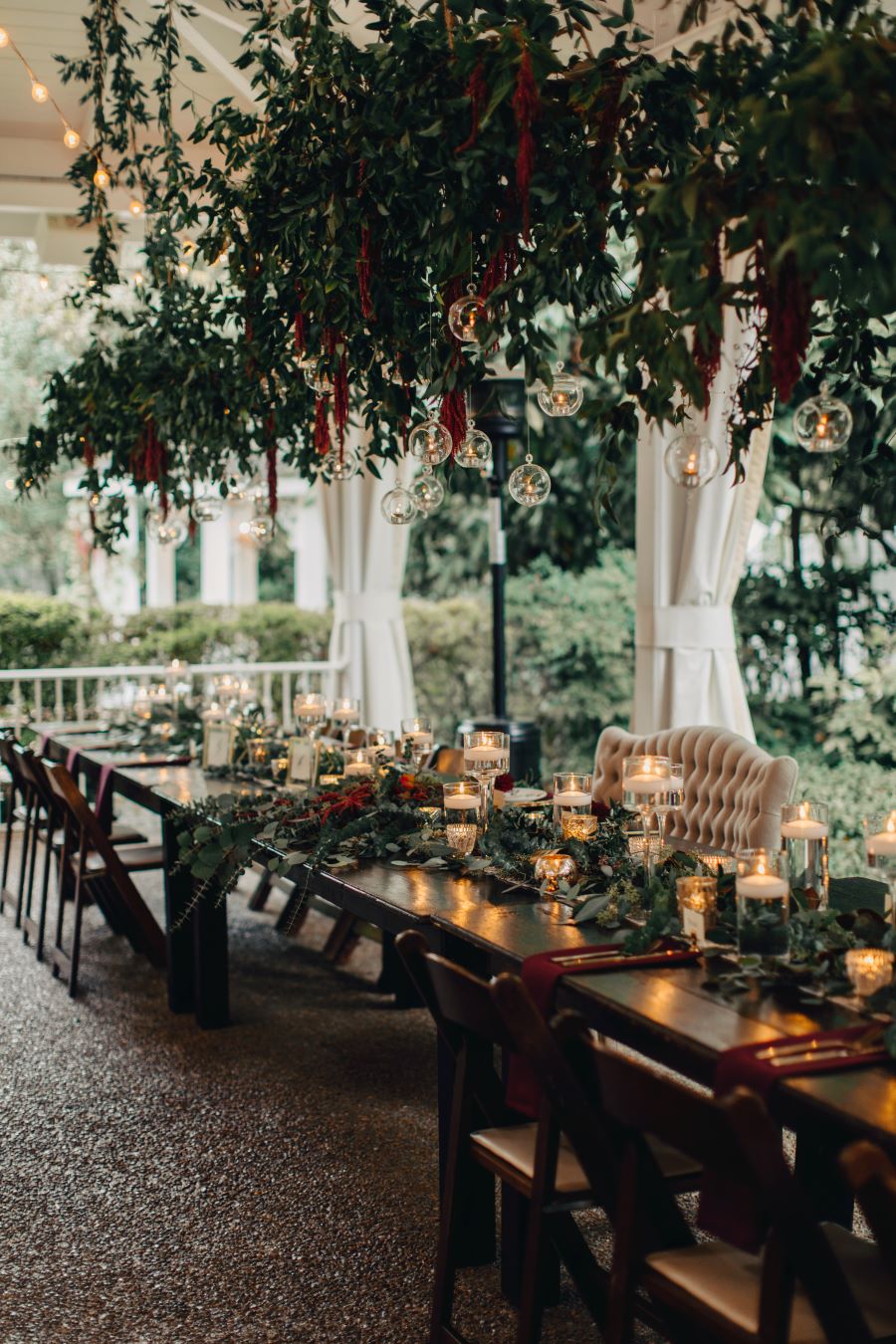 Head table with greenery and hanging lights above / earthy / fall / October / burgundy