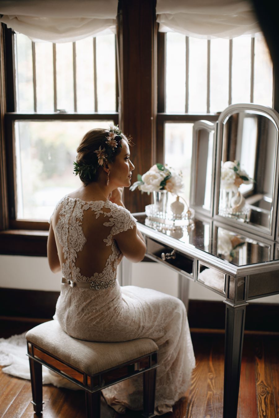 Bride sitting at vanity getting ready for her garden cermony / earthy / fall / October / burgundy