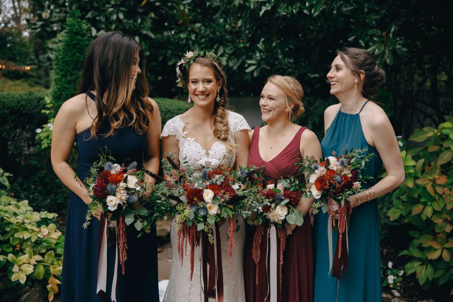 Bridal party smiling and holding their bouquets / earthy / fall / October / burgundy