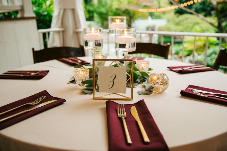 Simple tealight candles and greenery wedding table centerpiece / earthy / fall / October / burgundy