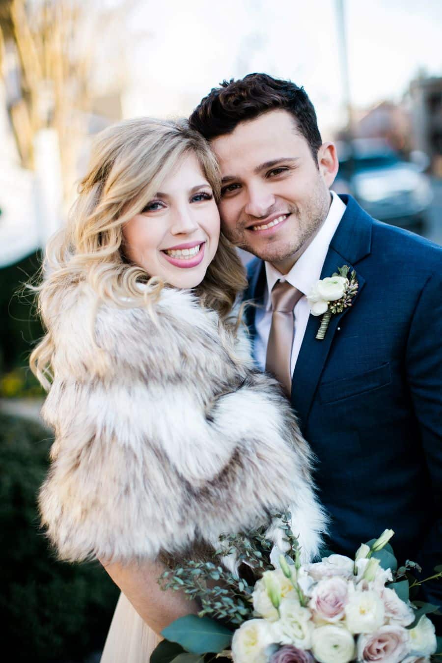 Bride wearing fur caplet and smiling with groom / Elopement / Spring / March / Dusty Rose