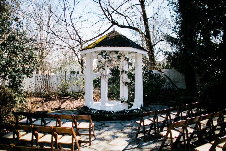 Empty garden with pagoda and chairs set up for elopement / Elopement / Spring / March / Dusty Rose