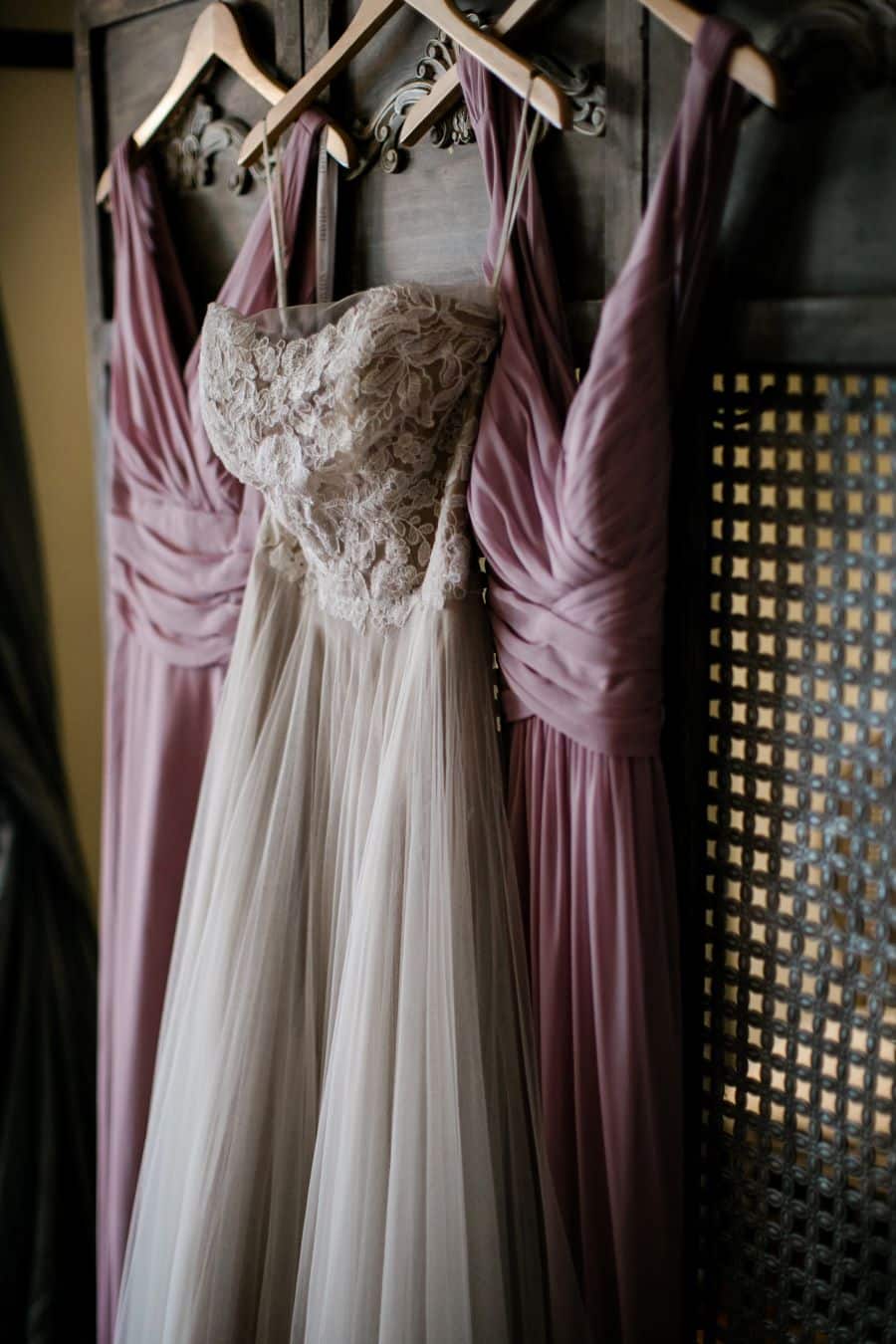 Bride's lace dress hanging with bridesmaids dusty rose dresses / Elopement / Spring / March / Dusty Rose