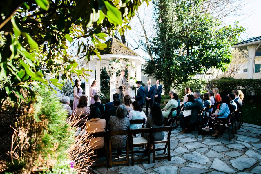 Small outdoor ceremony in garden of CJ's Off the Square / Elopement / Spring / March / Dusty Rose
