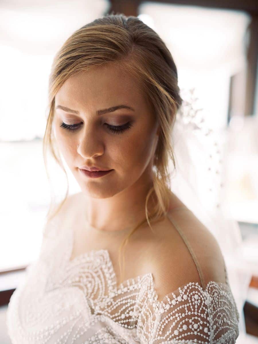 Close up of bride looking down in dressing room / Elopement / Summer / August