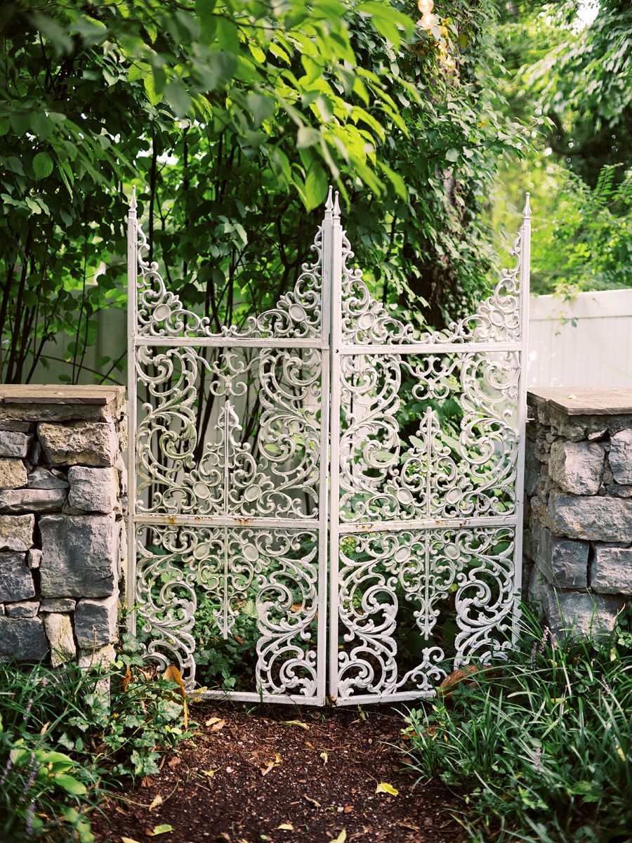 Decorative fence in the garden of wedding venue / Elopement / Summer / August