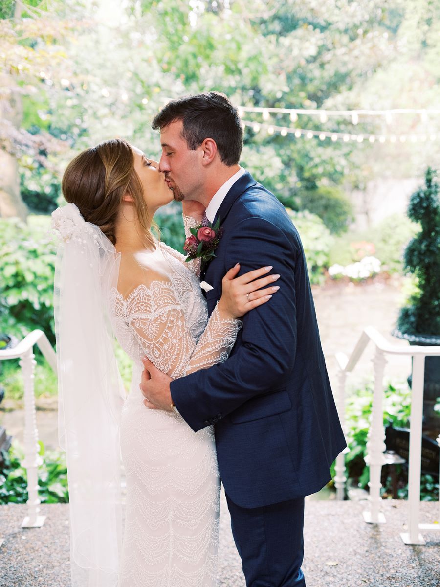 Bride and groom kissing at venue after their private ceremony / Elopement / Summer / August