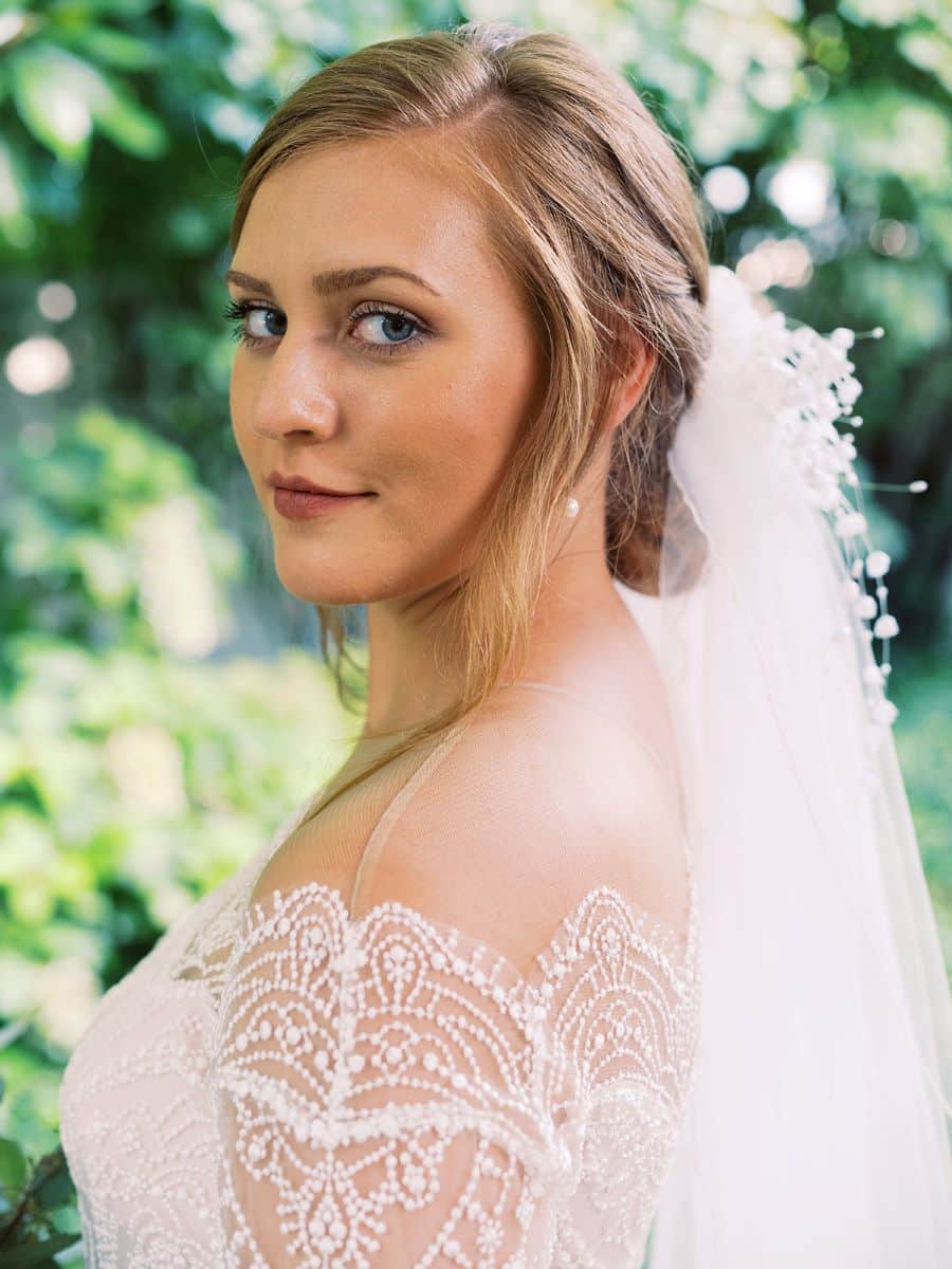 Close up of bride smiling with lace off shoulder dress / Elopement / Summer / August