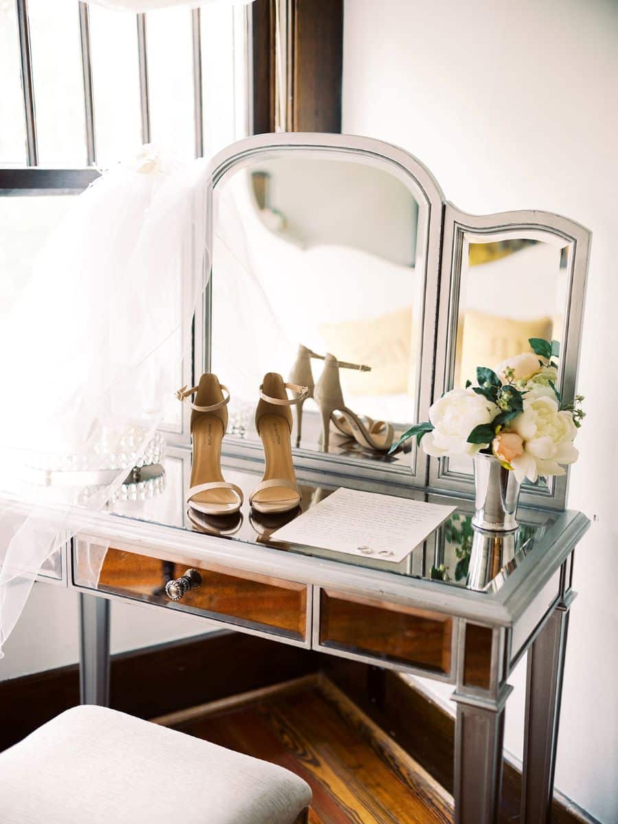 Image of vanity in bridal dressing room with heels and vows / Elopement / Summer / August