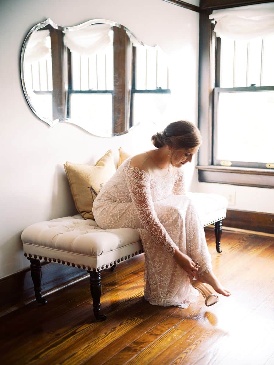 Bride putting on her shoes in bridal dressing room / Elopement / Summer / August