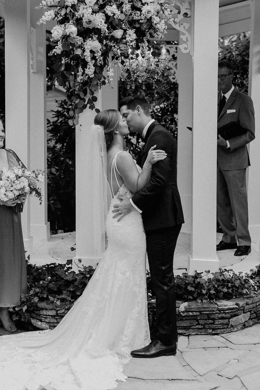 * Bride and groom walking through a romantic garden for their wedding ceremony at outdoor wedding venue CJ’s Off the Square (Franklin, TN). 