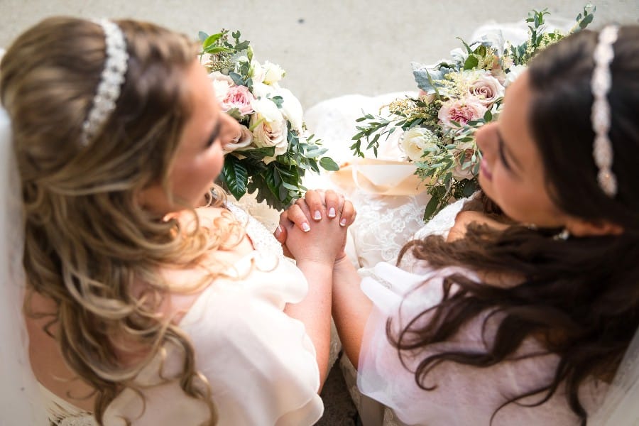 romantic garden wedding in shades of pink for lesbian couple