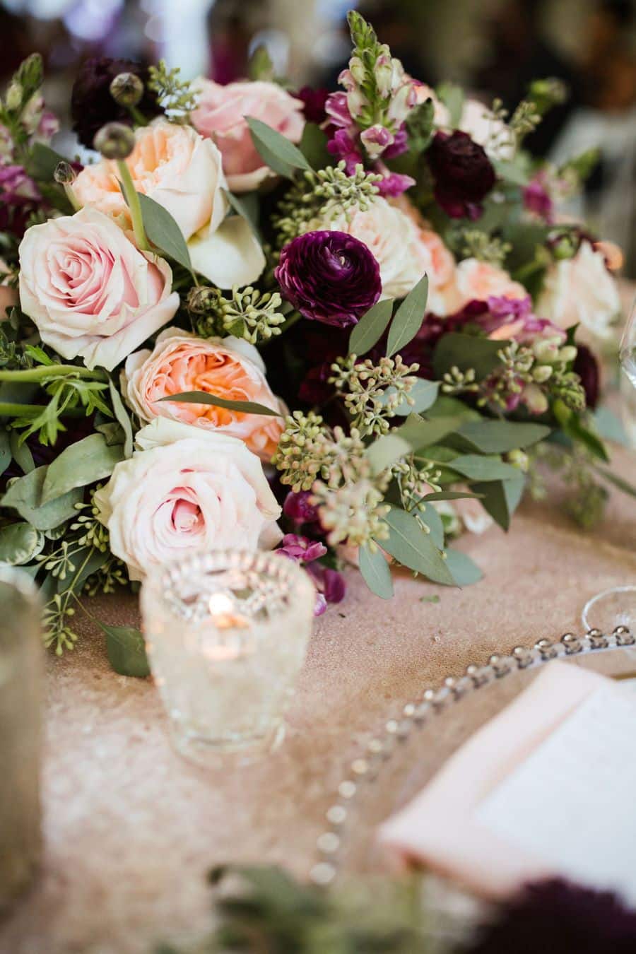 Wine, peach, blush colored floral arrangement on sweetheart table / romantic lgbtq / fall / September / blush / burgundy
