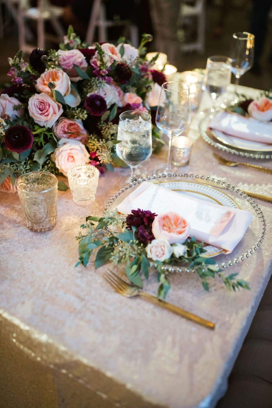 Sweetheart table with glitter tablecloth and lush floral centerpiece / romantic lgbtq / fall / September / blush / burgundy