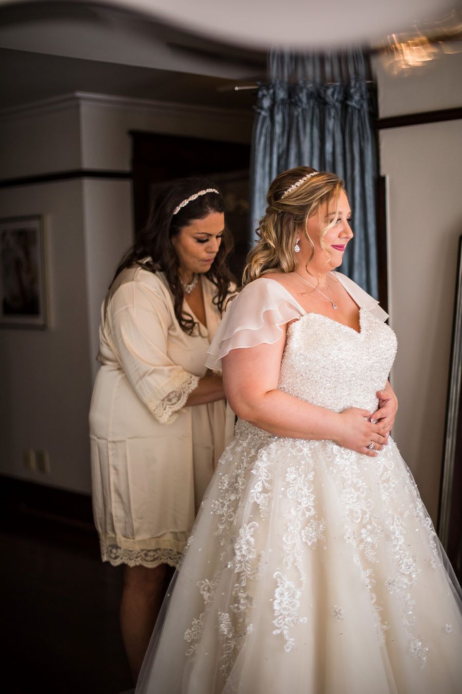 Bride being zipped into lace and beaded gown before lgbt wedding / Romantic / Summer / September / Pink / Dusty Rose / Cream