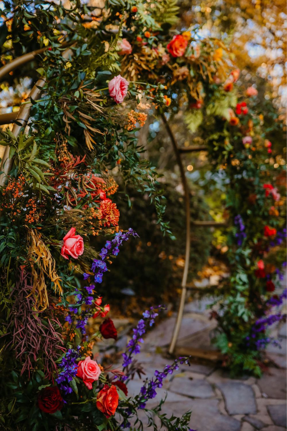 Orange and red fall garden wedding ceremony arch | CJ's Off the Square in Franklin, TN