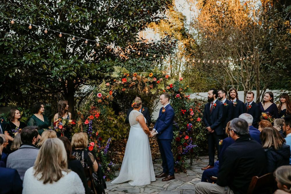 Orange and red fall garden wedding ceremony arch | CJ's Off the Square in Franklin, TN