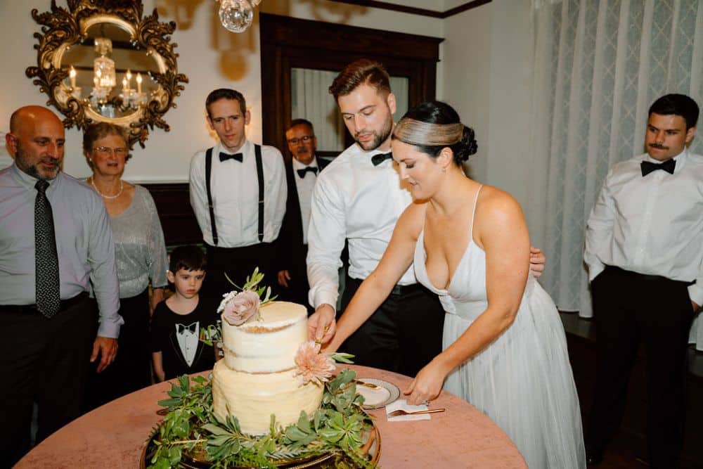 bride and groom cut wedding cake | CJ's Off the Square wedding venue Franklin, TN