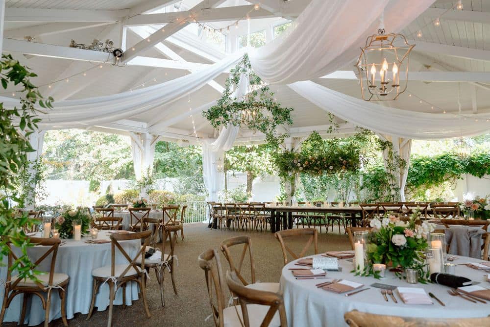 outdoor wedding reception with cross back chairs and greenery | CJ's Off the Square wedding venue Franklin, TN