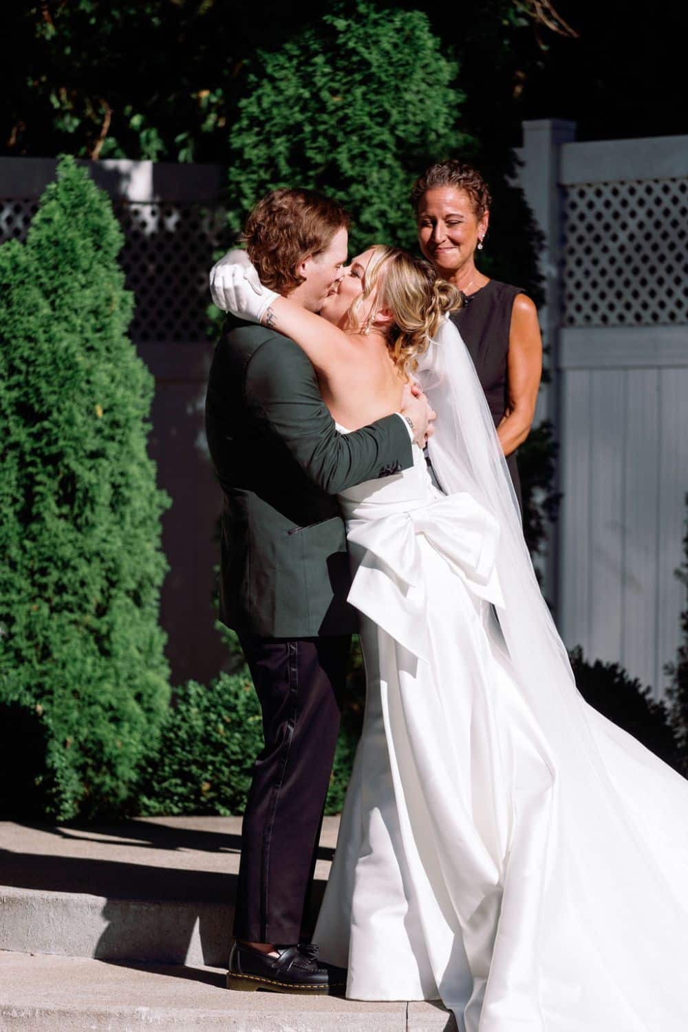 bride and groom first kiss| CJ's Off the Square, Franklin, TN