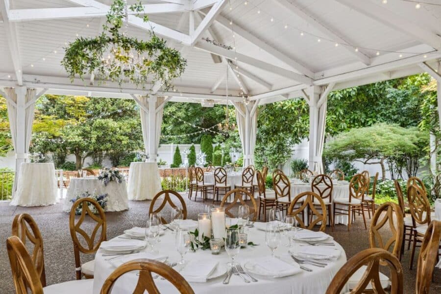 Pavilion set for a celebration with summer flowers in the garden at CJ’s Off the Square in Franklin, Tennessee