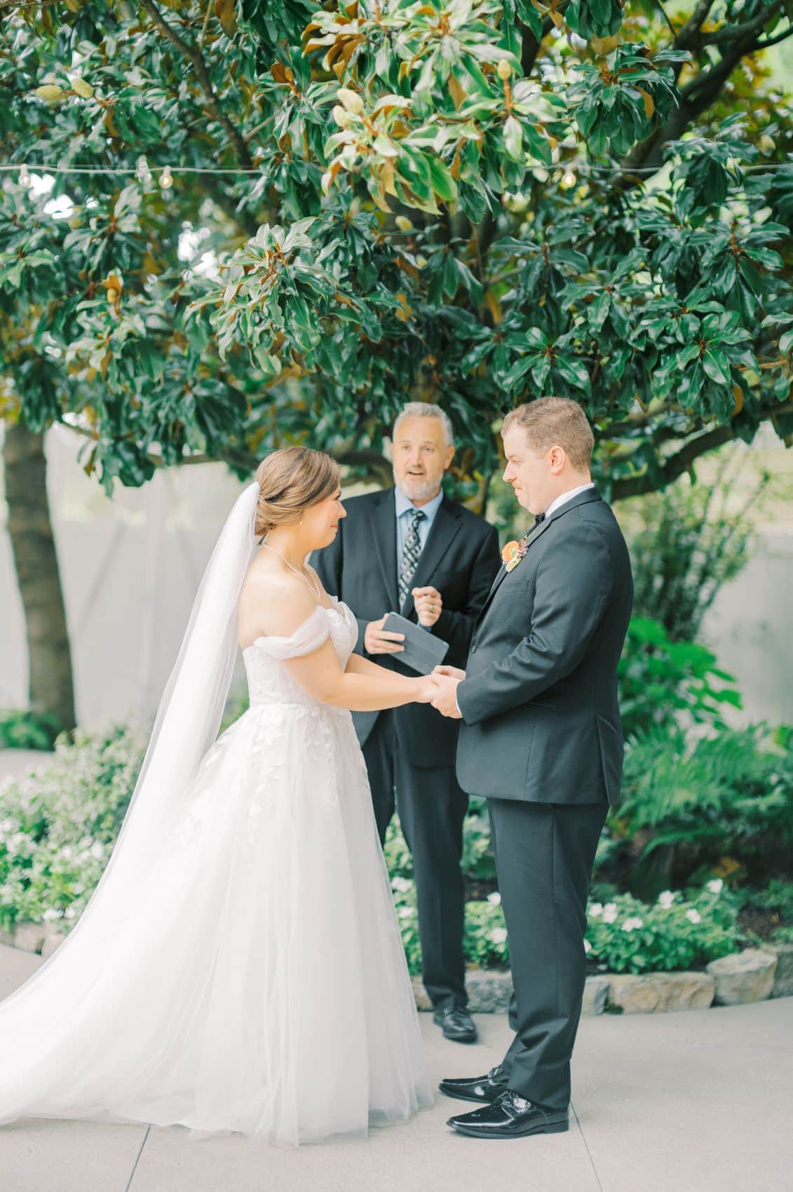 bride and groom at small garden wedding ceremony | CJ's Off the Square Franklin, TN