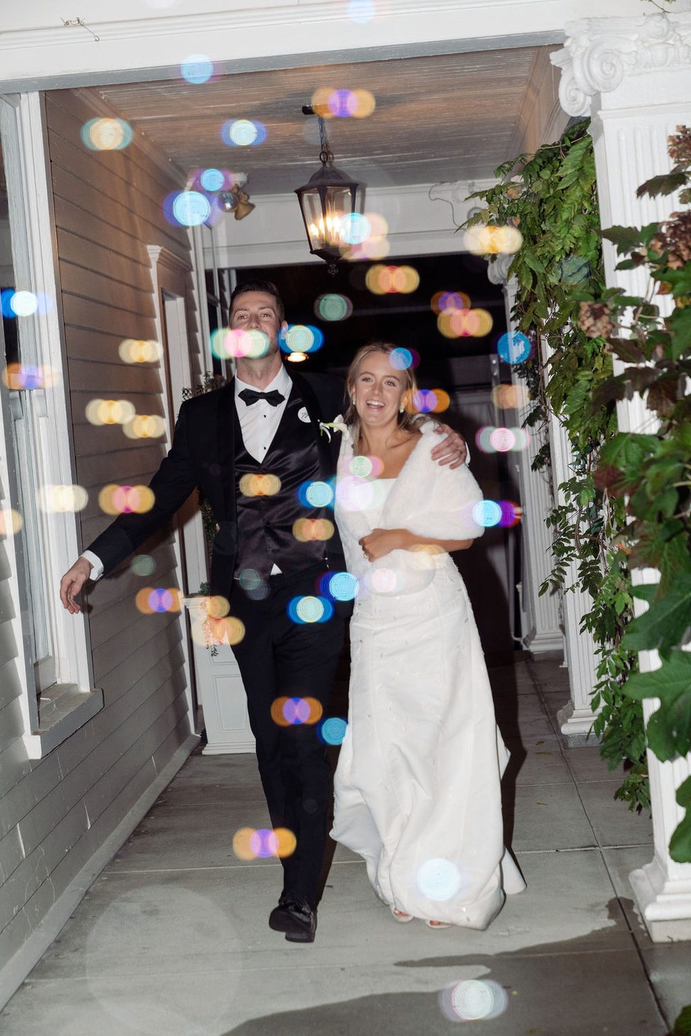 Newlyweds Addison and Caleb during their wedding reception exit