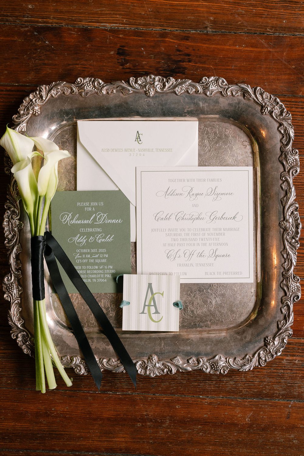 Wedding invitation details and a white calla lily for Addison and Caleb