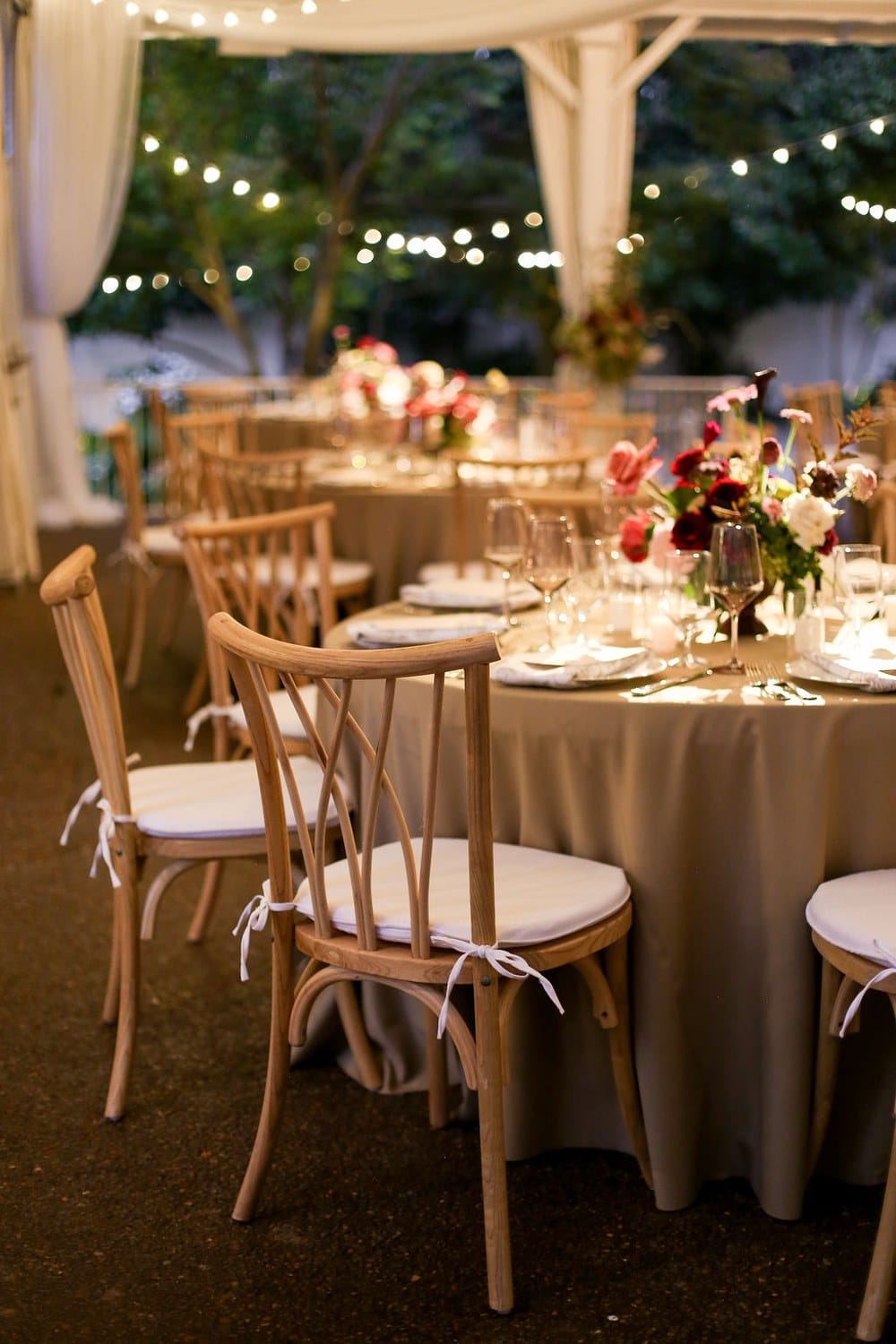 Elegant wedding reception table setting at twilight in CJ's Off the Square pavilion
