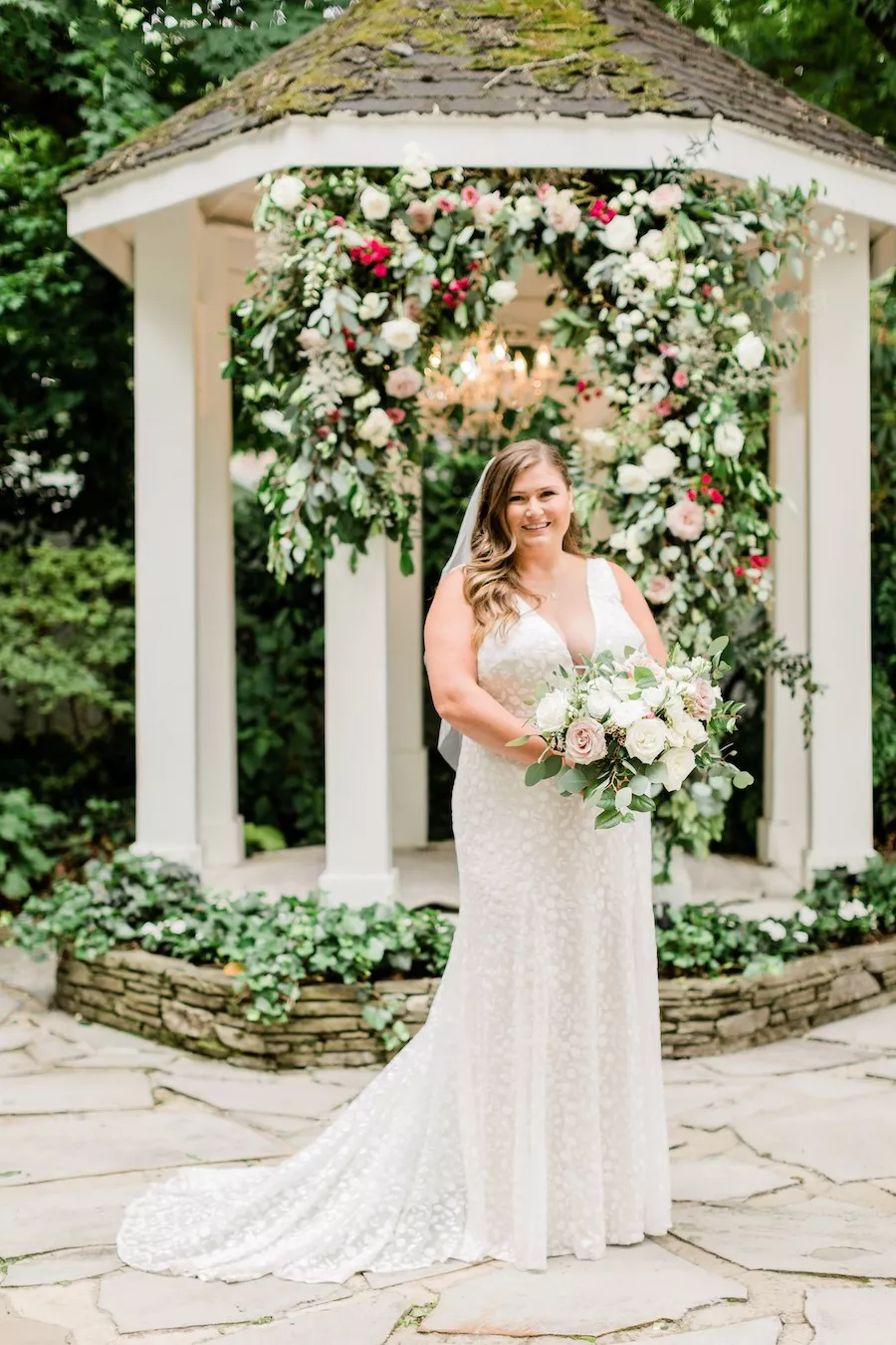 portrait of june bride and groom in garden venue