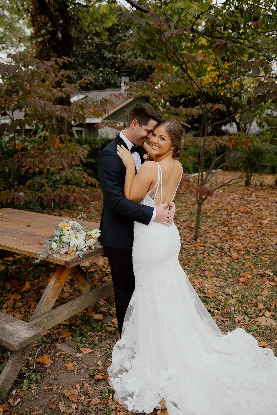 * Bride and groom walking through a romantic garden for their wedding ceremony at outdoor wedding venue CJ’s Off the Square (Franklin, TN). 