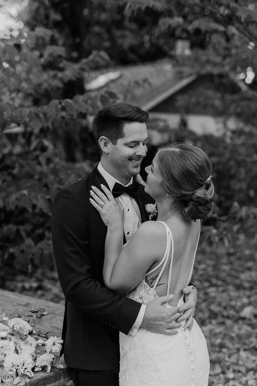 * Bride and groom walking through a romantic garden for their wedding ceremony at outdoor wedding venue CJ’s Off the Square (Franklin, TN). 
