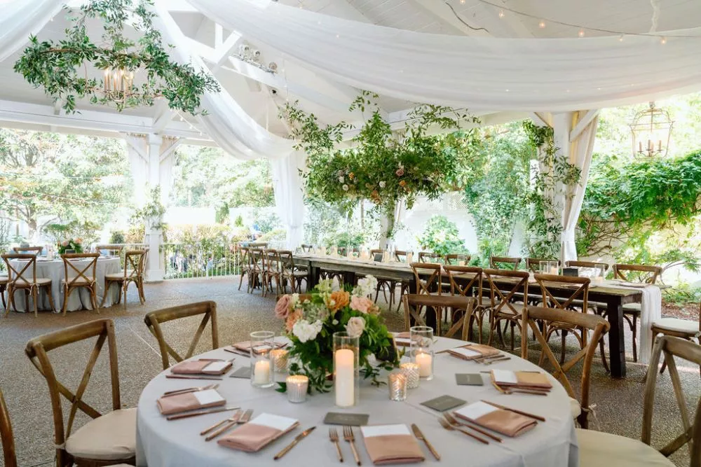 outdoor wedding reception with cross back chairs and greenery | CJ's Off the Square wedding venue Franklin, TN